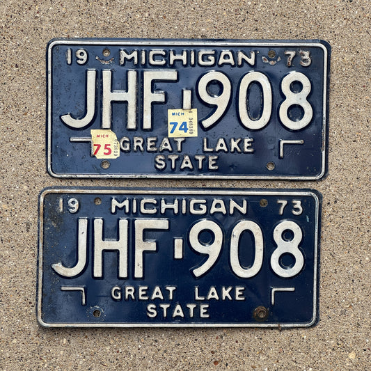 Photo of a 1973 1975 Michigan License Plate Pair Auto Tag Garage Decor Vintage JHF 908 with original patina