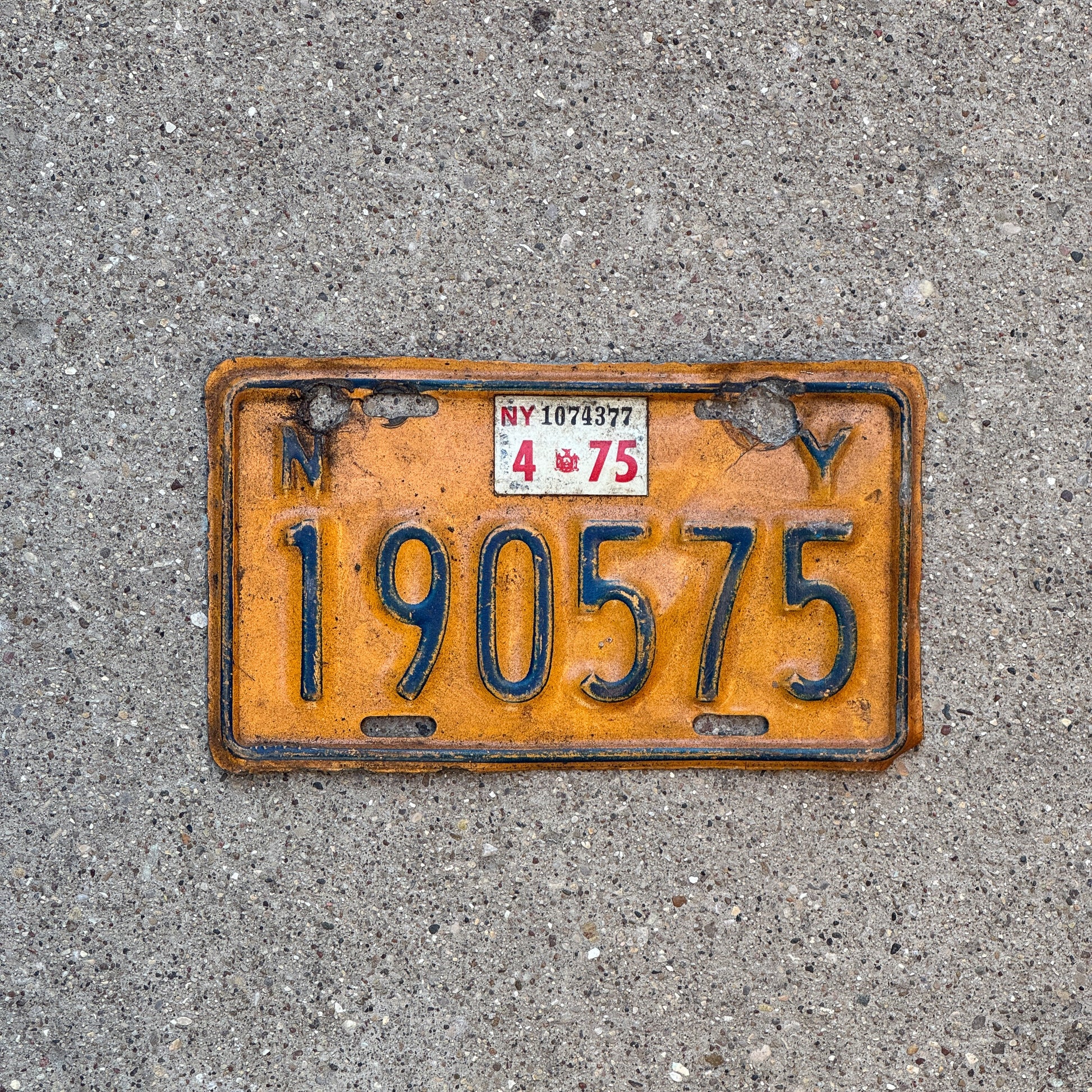 Photo of a 1973 1975 New York Motorcycle License Plate Auto Tag Garage Decor Vintage 190575 with original patina