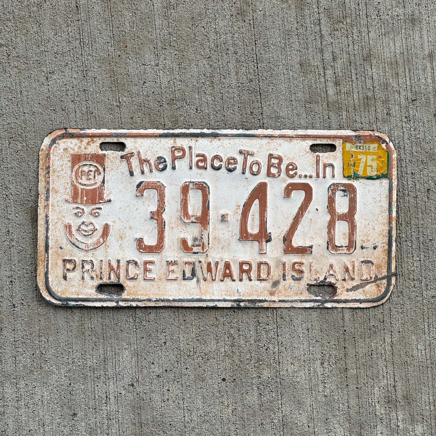 Photo of a 1973 1975 Prince Edward Island License Plate Auto Tag Garage Decor Vintage PEI Father of Confederation Graphic 39 428 with original patina