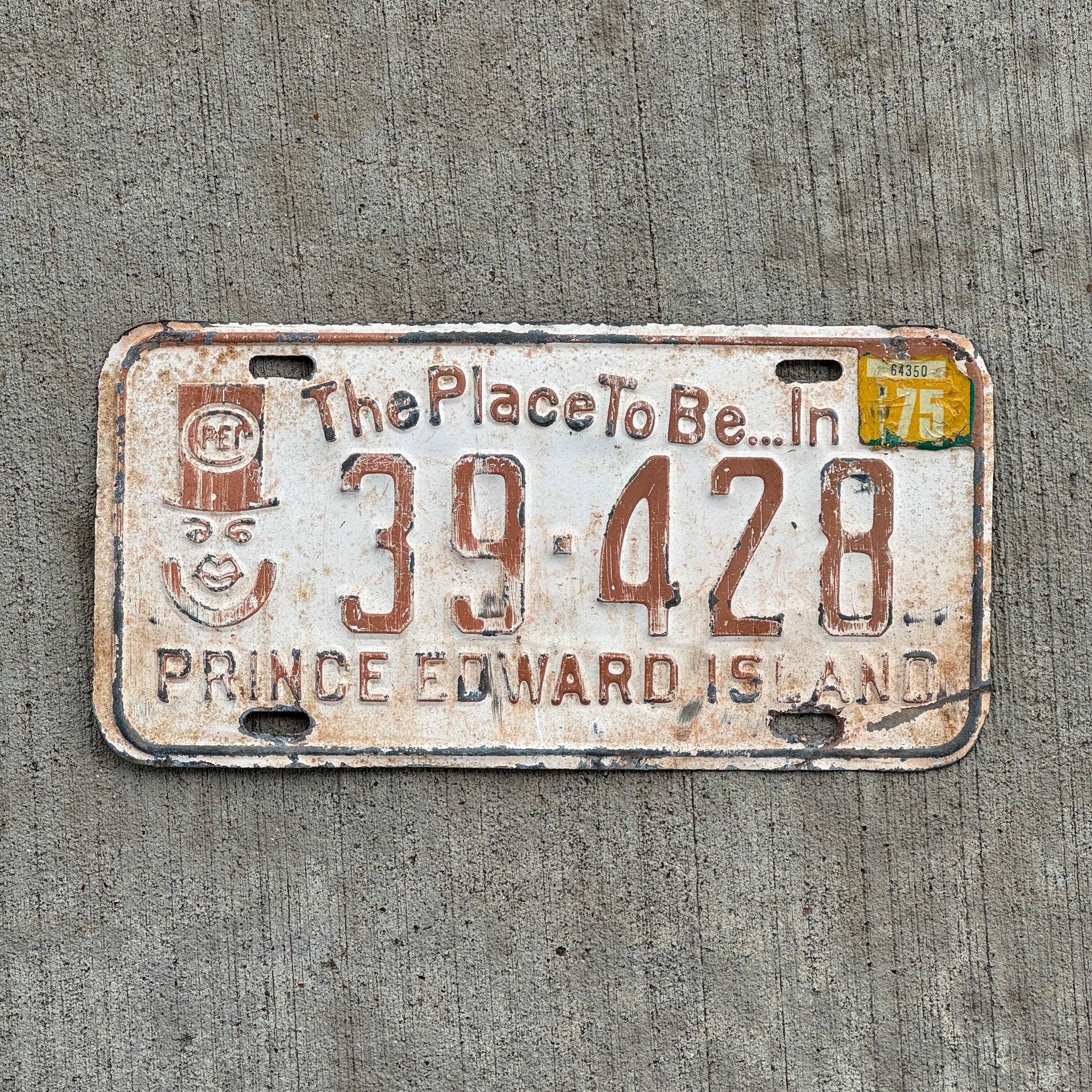 Photo of a 1973 1975 Prince Edward Island License Plate Auto Tag Garage Decor Vintage PEI Father of Confederation Graphic 39 428 with original patina