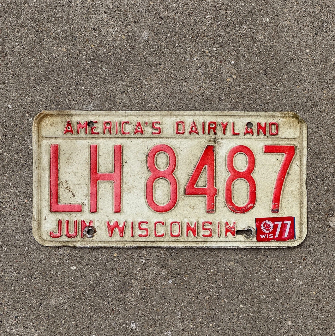 Photo of a 1973 1977 Wisconsin License Plate Auto Tag Garage Decor Dairyland Dairyland LH 8487