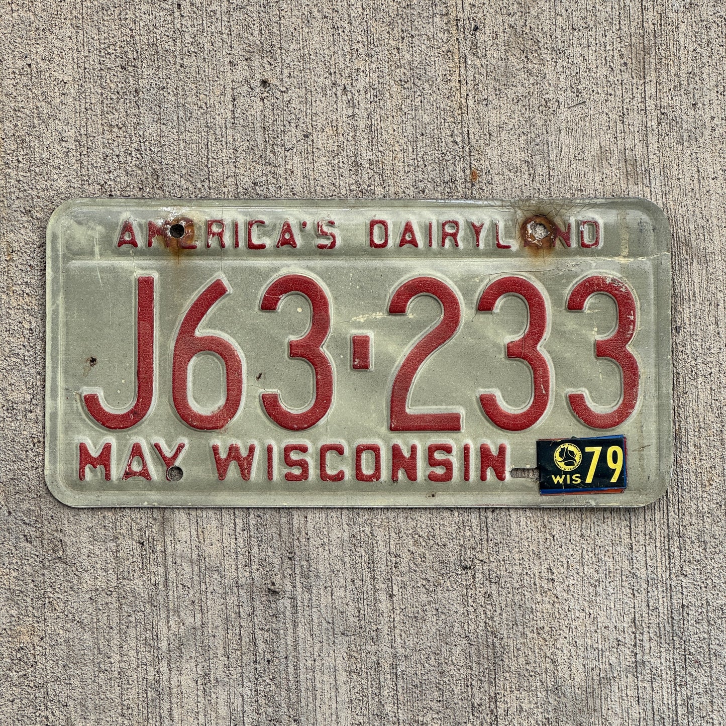 Photo of a 1973 1979 Wisconsin License Plate Auto Tag Garage Decor Vintage J 63 233 with original patina