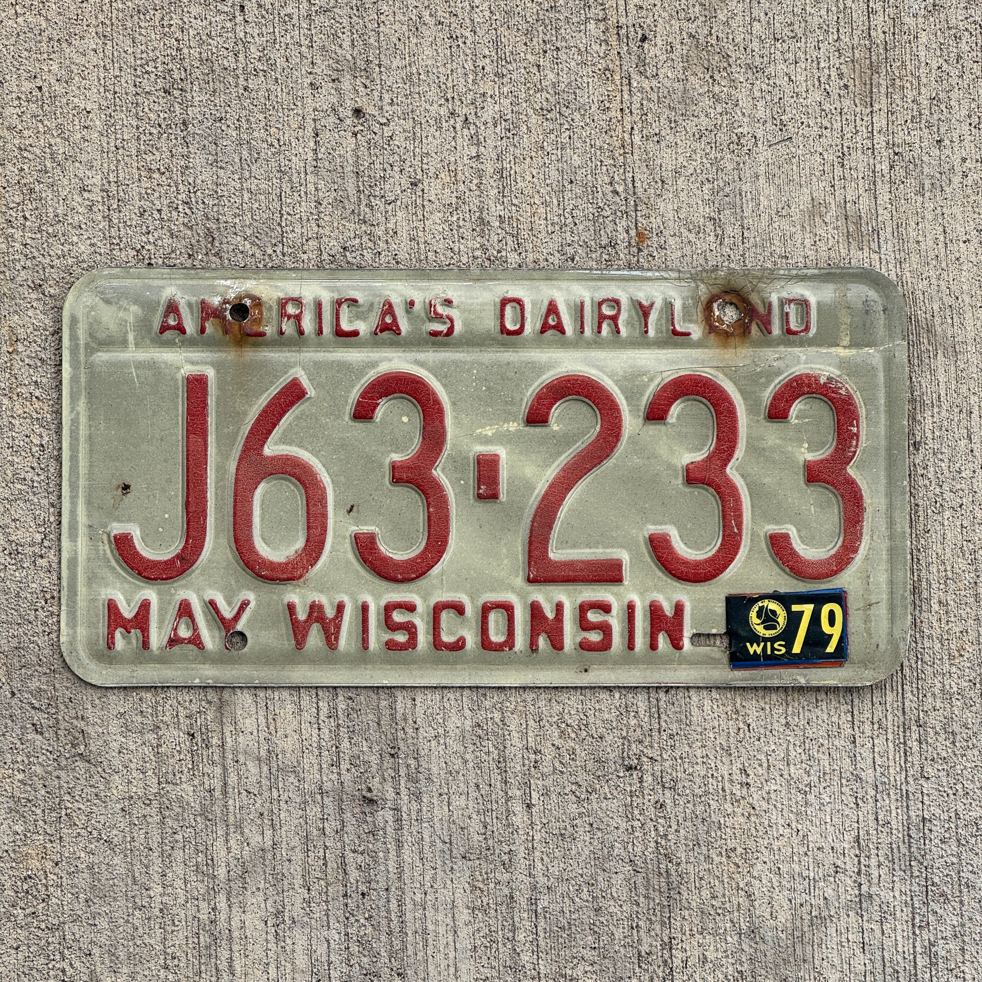 Photo of a 1973 1979 Wisconsin License Plate Auto Tag Garage Decor Vintage J 63 233 with original patina