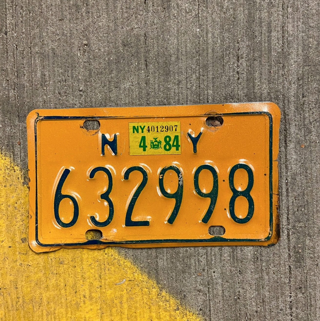 Photo of a 1973 1984 New York Motorcycle License Plate Auto Tag Garage Decor Vintage 632998 with original patina