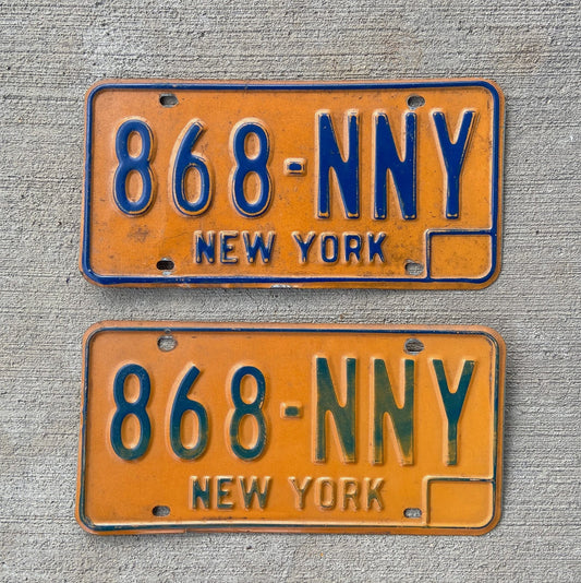Photo of a 1973 1986 New York License Plate Pair Auto Tag Garage Decor Vintage YOM DMV Clear 868 NNY with original patina