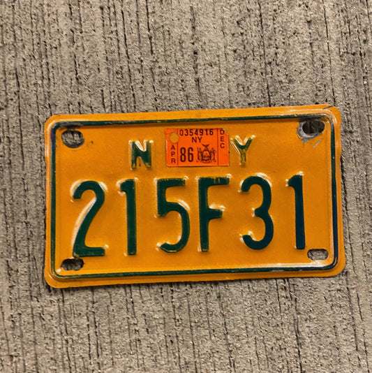 Photo of a 1973 1986 New York Motorcycle License Plate Auto Tag Garage Decor Vintage 215 F 31 with original patina