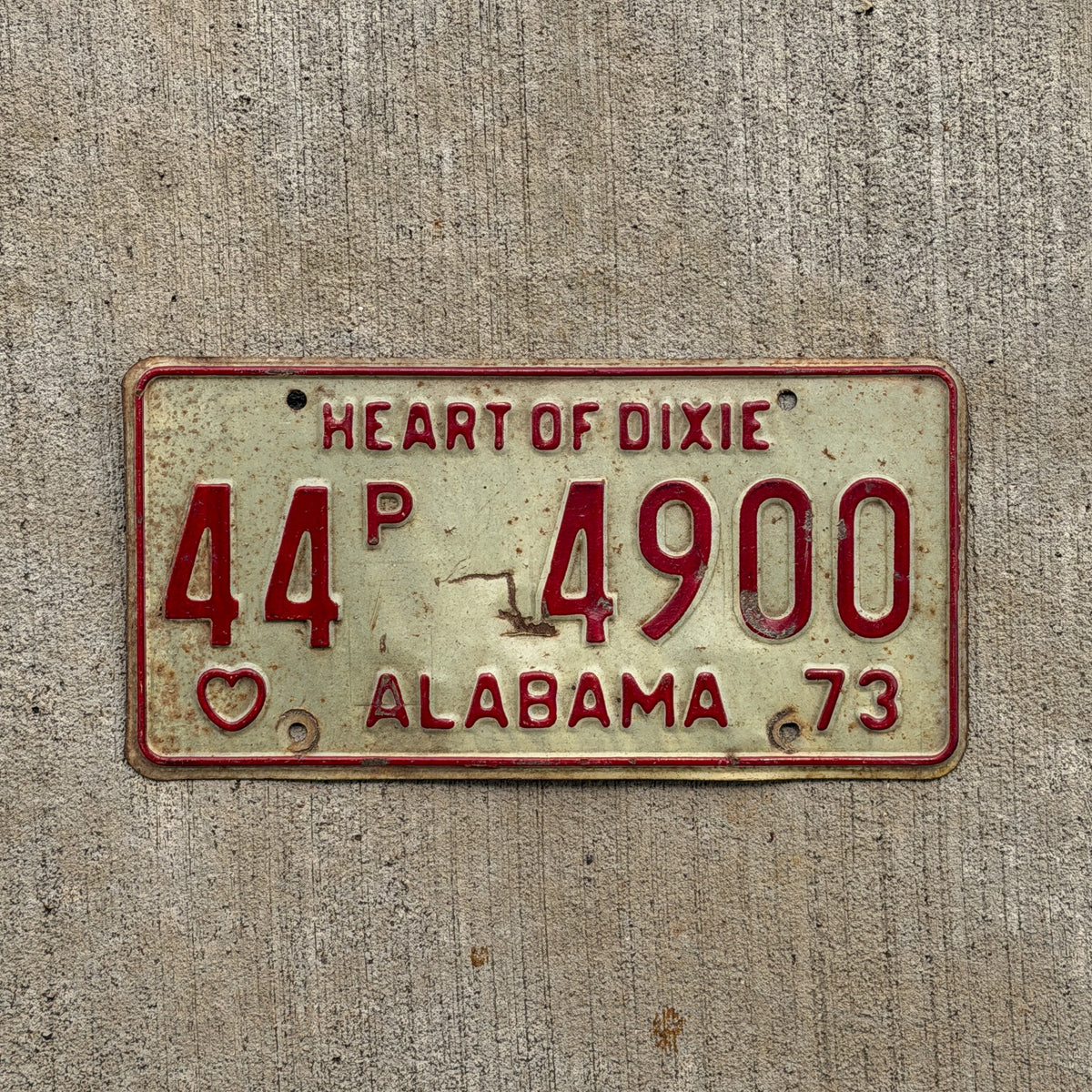 Photo of a 1973 Alabama Truck License Plate Auto Tag Garage Decor Vintage 44 P 4900 with original patina