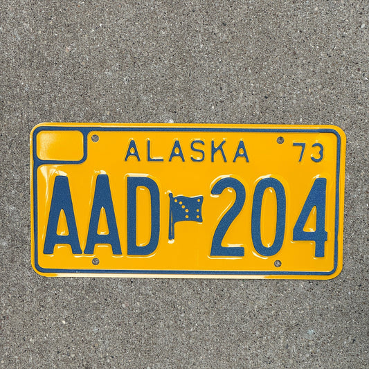 Photo of a 1973 Alaska License Plate Auto Tag Garage Decor Vintage Less than 3600 Made, Hard to Find AAD 204 with original patina