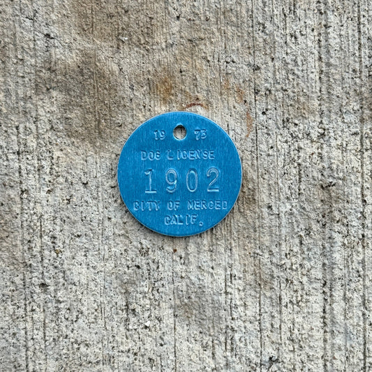 Photo of a 1973 California Dog License Auto Tag Garage Decor Vintage Merced 1902 with original patina