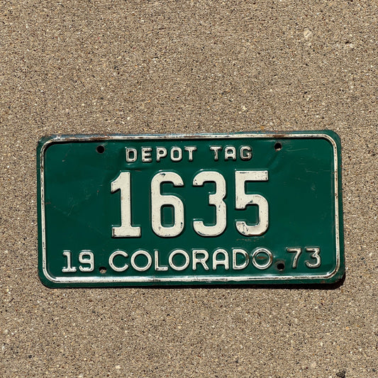 Photo of a 1973 Colorado Depot Tag License Plate Auto Tag Garage Decor Vintage 1635