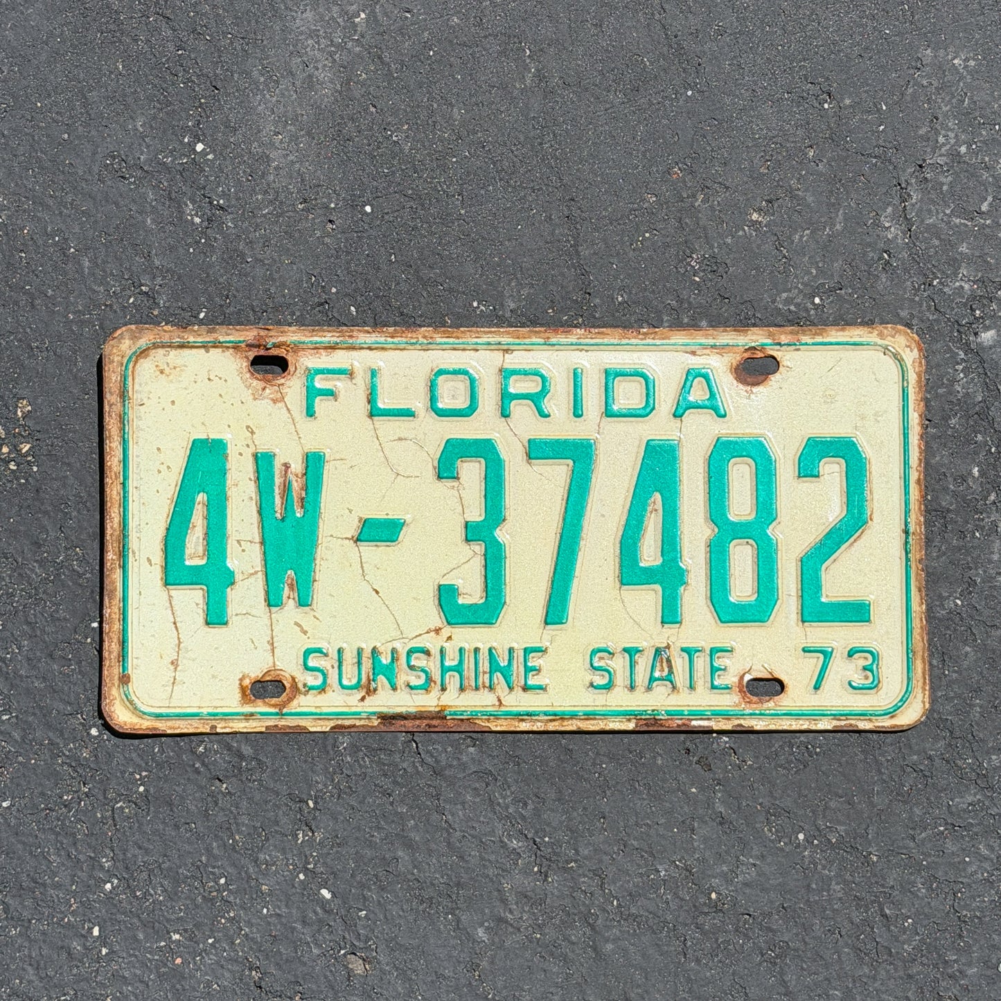 Photo of a 1973 Florida License Plate Auto Tag Garage Decor Vintage 4W 37482 with original patina