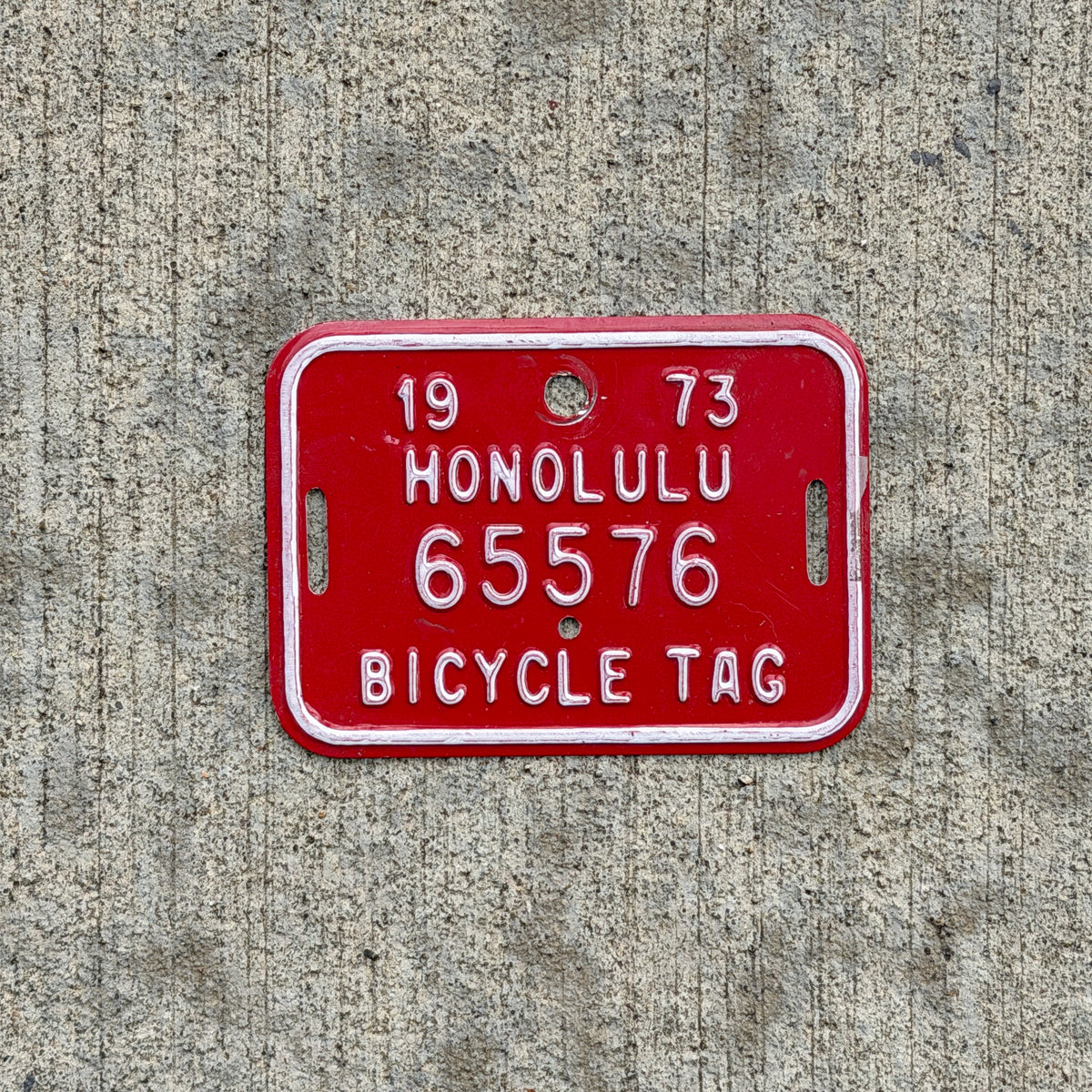 Photo of a 1973 Honolulu Hawaii Bicycle License Plate Auto Tag Garage Decor Vintage Bike 65576 with original patina