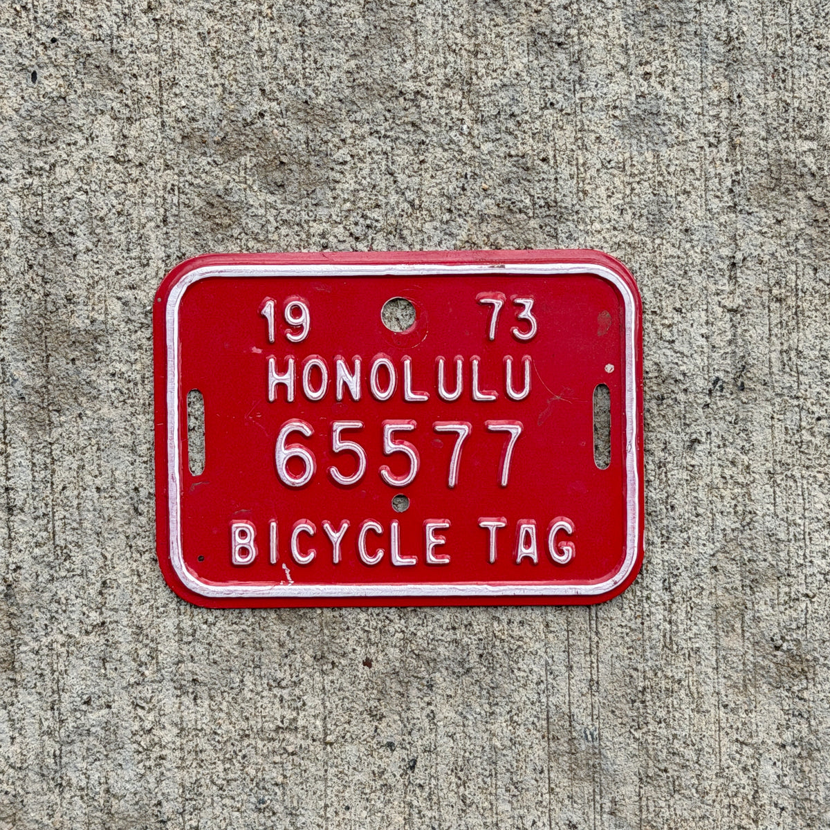 Photo of a 1973 Honolulu Hawaii Bicycle License Plate Auto Tag Garage Decor Vintage Bike 65577 with original patina