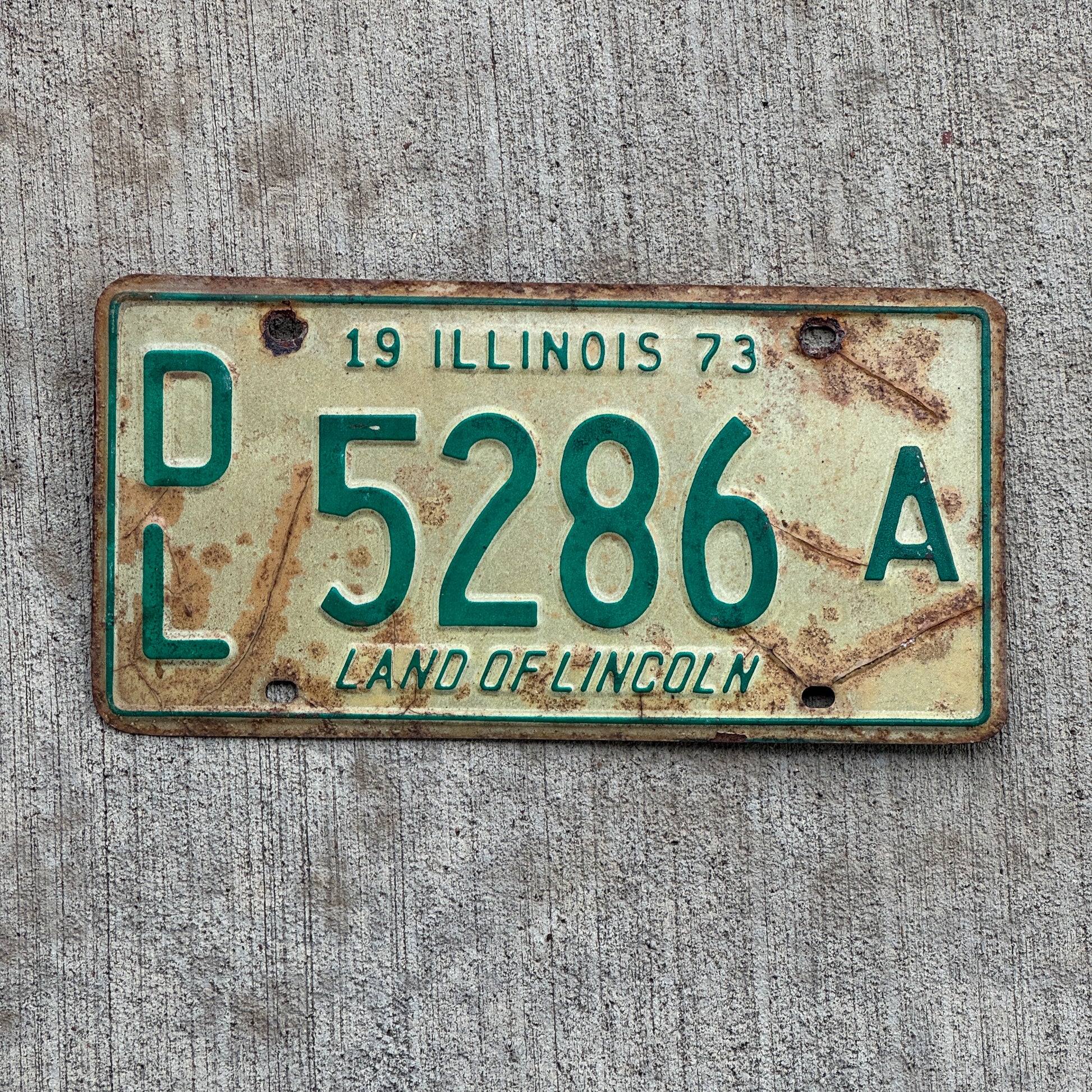 Photo of a 1973 Illinois Dealer License Plate Auto Tag 1 Vintage Garage 5286 A with original patina