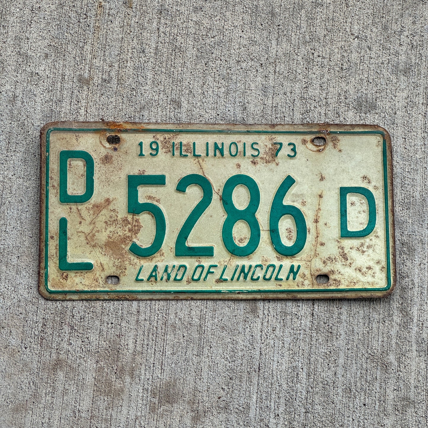 Photo of a 1973 Illinois Dealer License Plate Auto Tag 1 Vintage Garage 5286 D with original patina