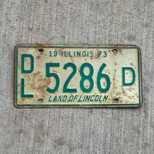Photo of a 1973 Illinois Dealer License Plate Auto Tag 1 Vintage Garage 5286 D with original patina