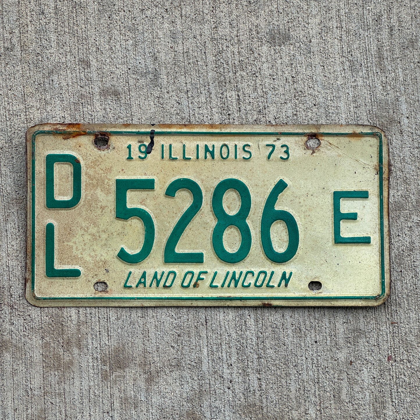 Photo of a 1973 Illinois Dealer License Plate Auto Tag 2 Vintage Garage 5286 E with original patina