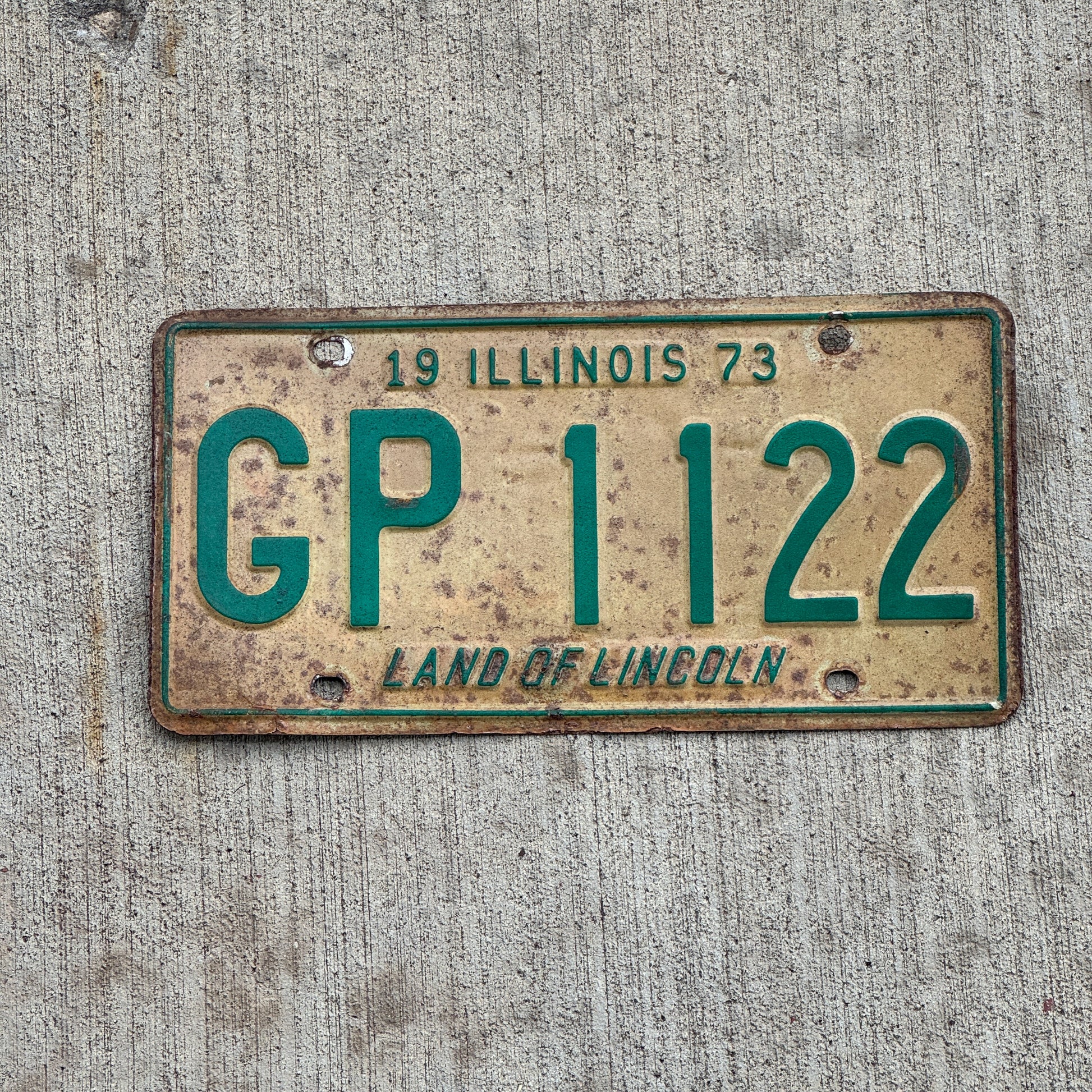 Photo of a 1973 Illinois License Plate Auto Tag 1 Vintage Garage GP 1122 with original patina