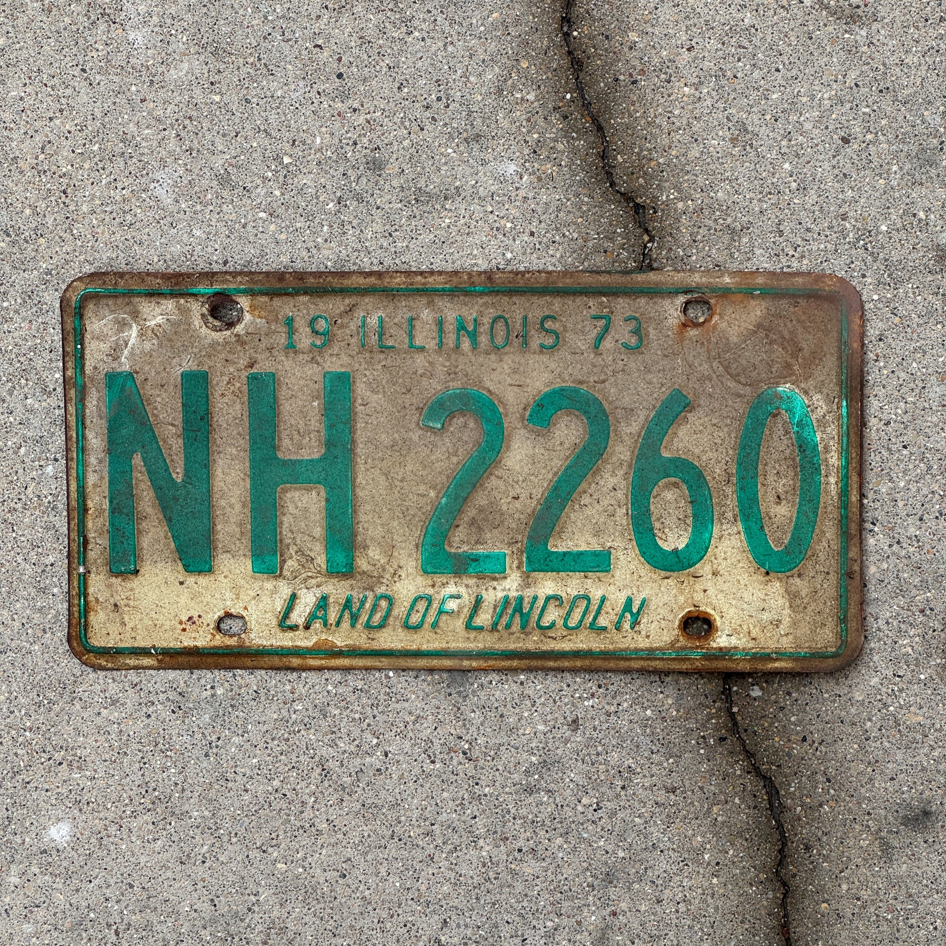 Photo of a 1973 Illinois License Plate Auto Tag 1 Vintage Garage NH 2260 with original patina