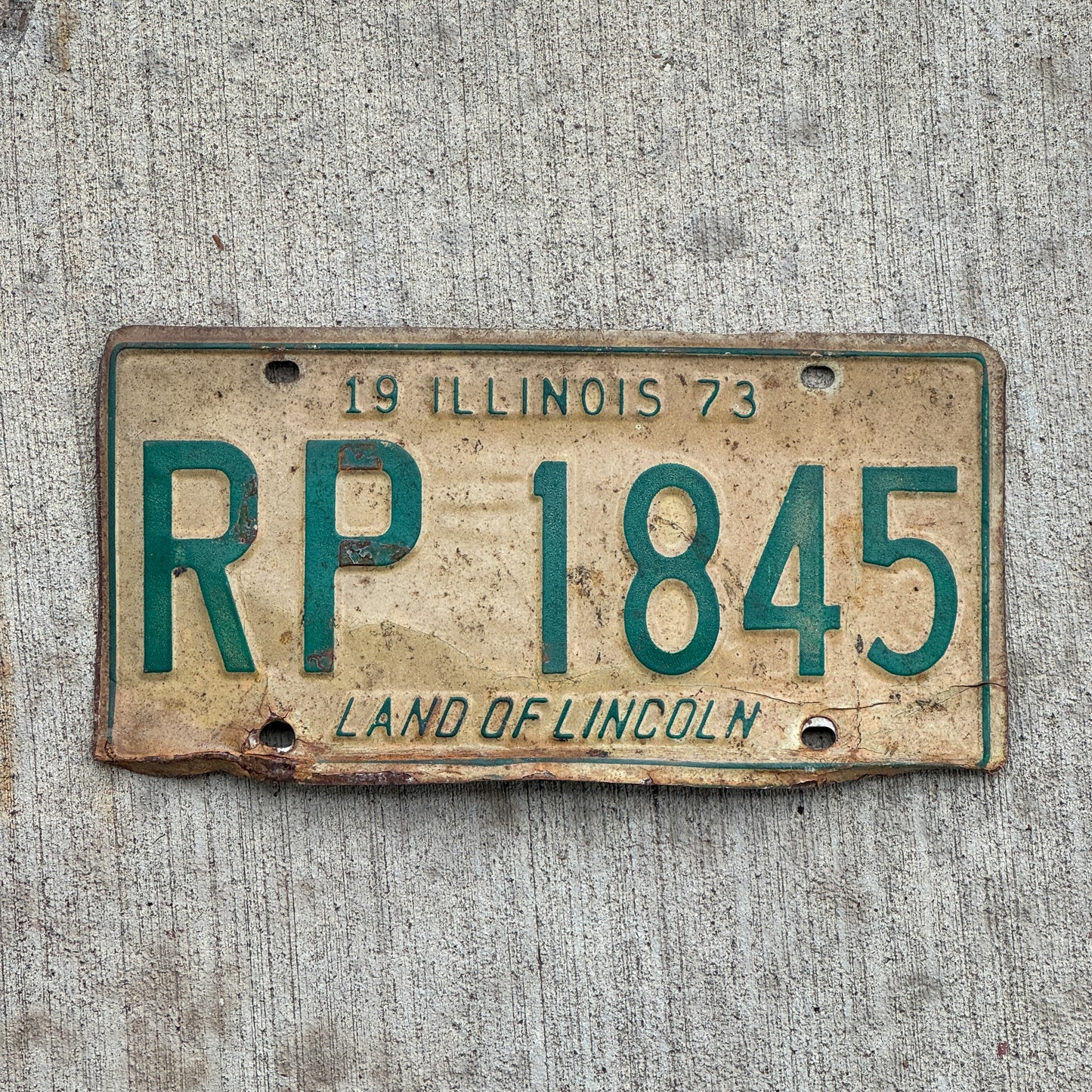 Photo of a 1973 Illinois License Plate Auto Tag 1 Vintage Garage RP 1845 with original patina
