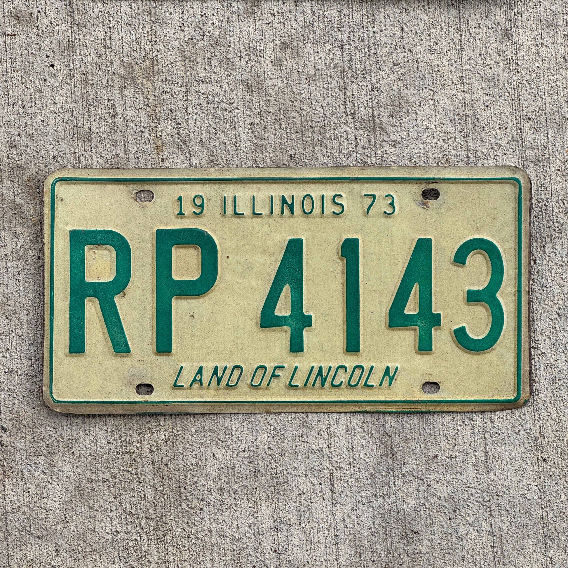 Photo of a 1973 Illinois License Plate Auto Tag 1 Vintage Garage RP 4143 with original patina