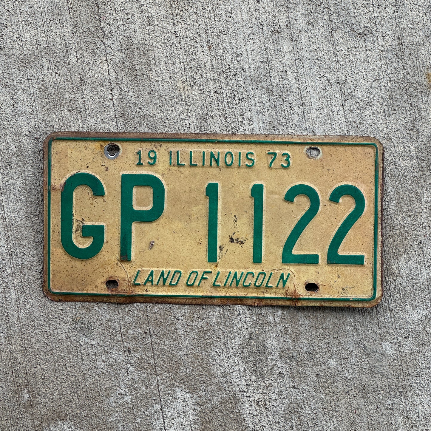 Photo of a 1973 Illinois License Plate Auto Tag 2 Vintage Garage GP 1122 with original patina