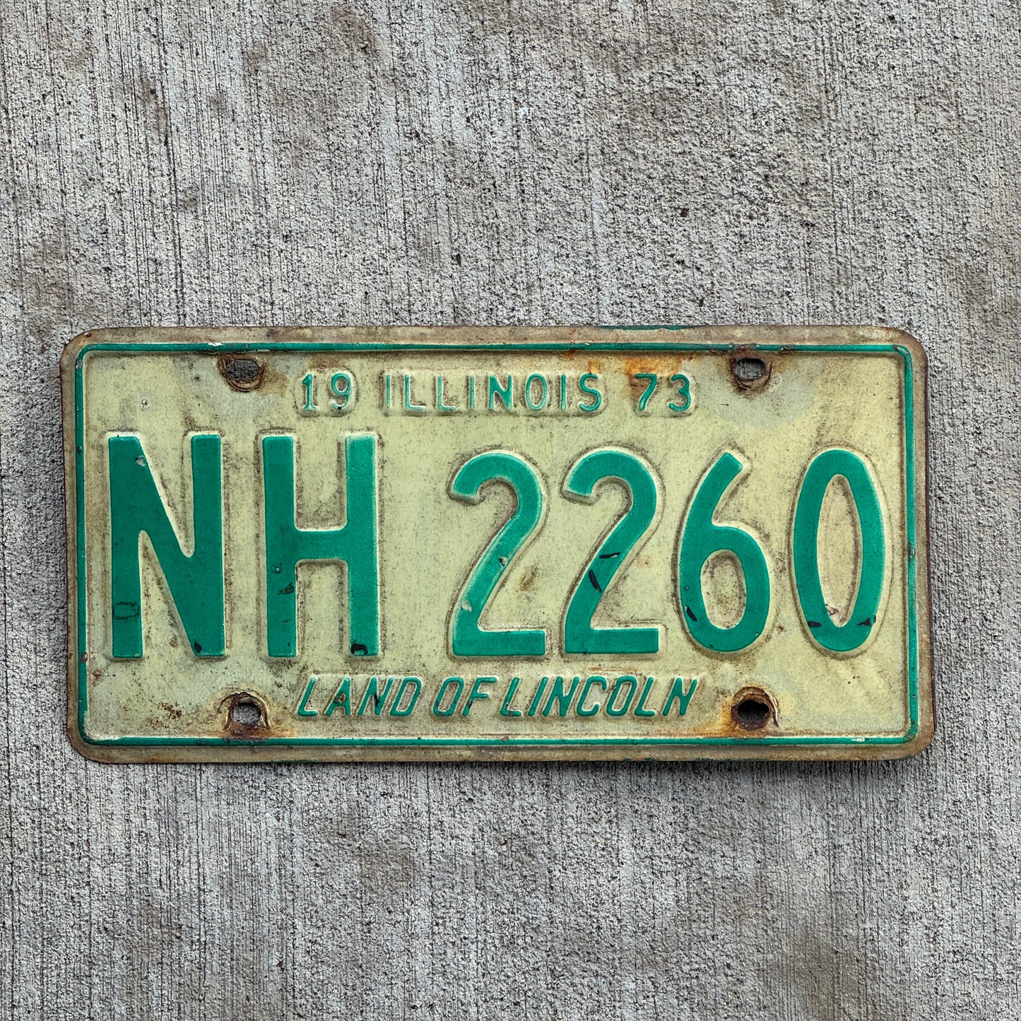 Photo of a 1973 Illinois License Plate Auto Tag 2 Vintage Garage NH 2260 with original patina