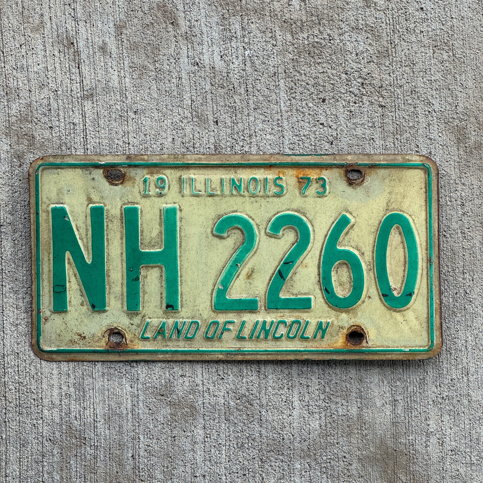 Photo of a 1973 Illinois License Plate Auto Tag 2 Vintage Garage NH 2260 with original patina