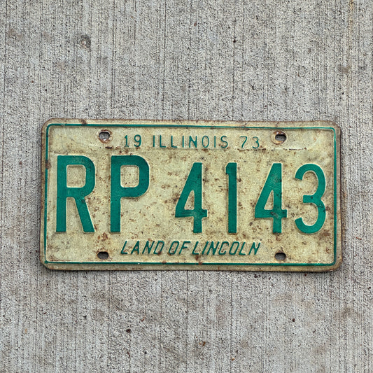 Photo of a 1973 Illinois License Plate Auto Tag 2 Vintage Garage RP 4143 with original patina