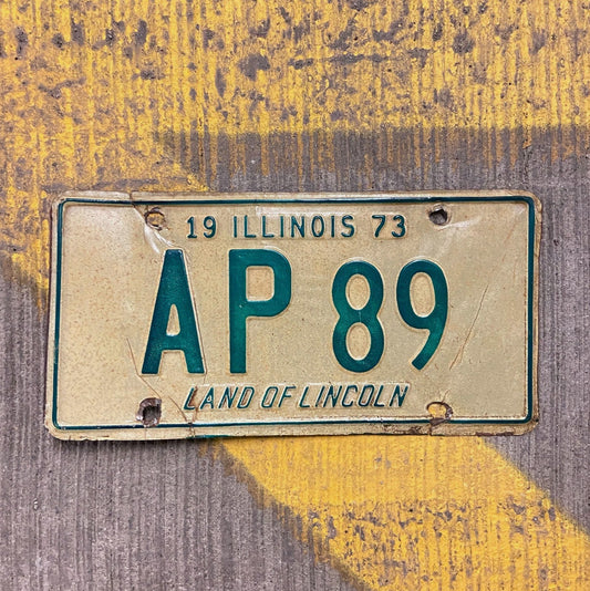 Photo of a 1973 Illinois License Plate Auto Tag Garage Decor Vintage AP 89 with original patina