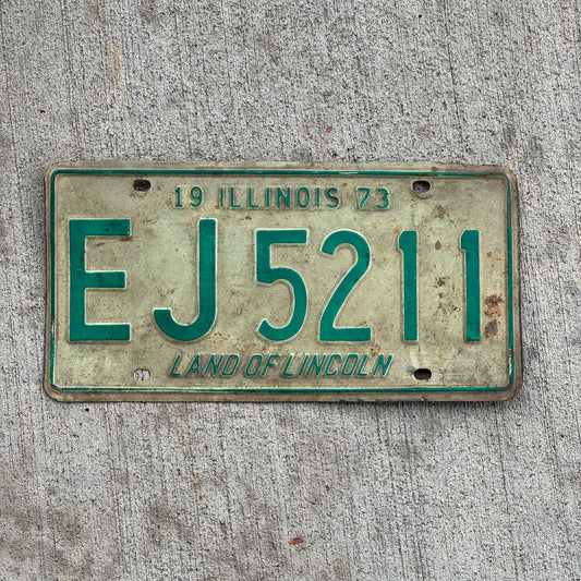 Photo of a 1973 Illinois License Plate Auto Tag Garage Decor Vintage EJ 5211 with original patina