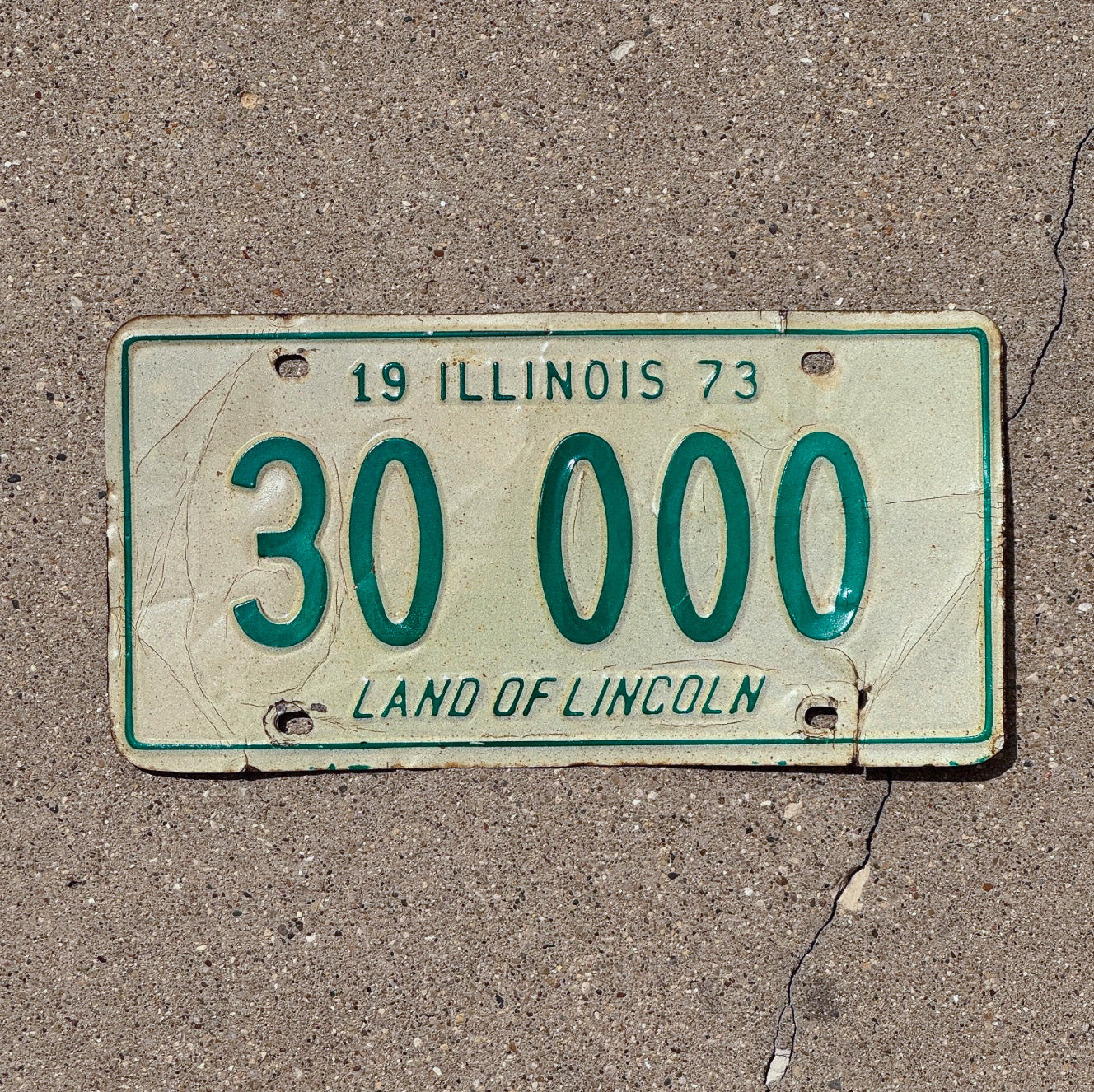 Photo of a 1973 Illinois License Plate Auto Tag Garage Decor Vintage Great Number 30 000 with original patina