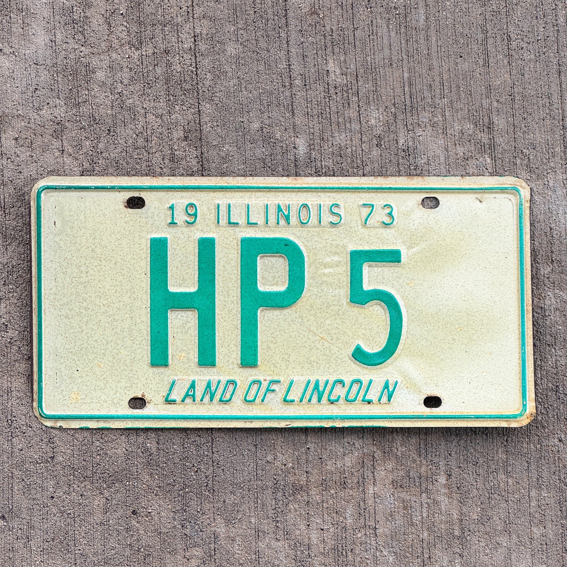 Photo of a 1973 Illinois License Plate Auto Tag Garage Decor Vintage HP 5 with original patina