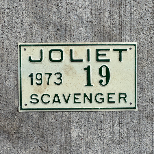 Photo of a 1973 Illinois Scavenger License Plate Auto Tag Garage Decor Vintage Joliet 19 with original patina
