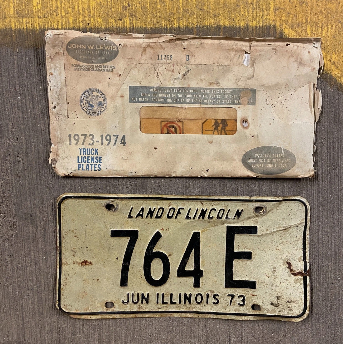 Photo of a 1973 Illinois Truck License Plate Auto Tag with Era Appropriate Envelope 764 E