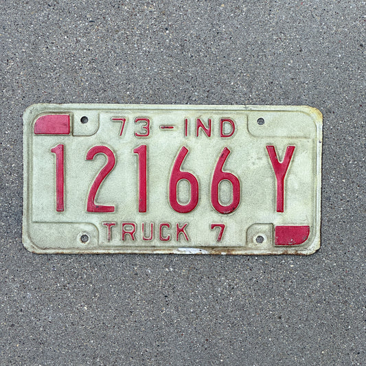 Photo of a 1973 Indiana Truck License Plate Auto Tag Garage Decor Vintage 12166 Y with original patina