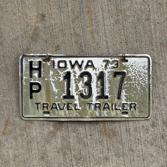 Photo of a 1973 Iowa Travel Trailer License Plate Auto Tag Garage Decor Vintage HP 1317 with original patina