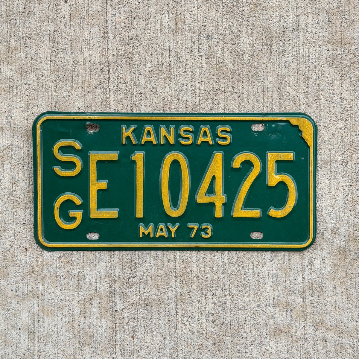 Photo of a 1973 Kansas License Plate Auto Tag Garage Decor Vintage SG E 10425 with original patina