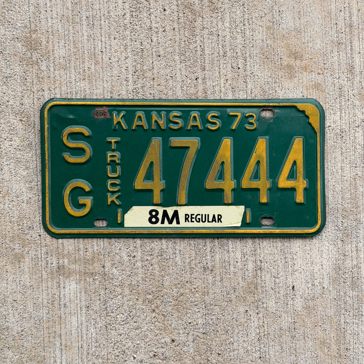 Photo of a 1973 Kansas Truck License Plate Auto Tag Garage Decor Vintage Repeat Repeating SG 47444 with original patina