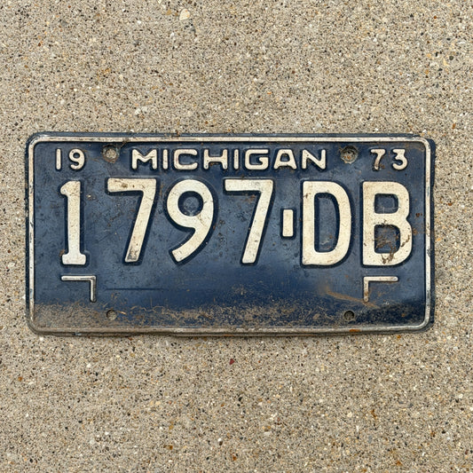 Photo of a 1973 Michigan Commercial License Plate Auto Tag Garage Decor Vintage 1797 DB with original patina