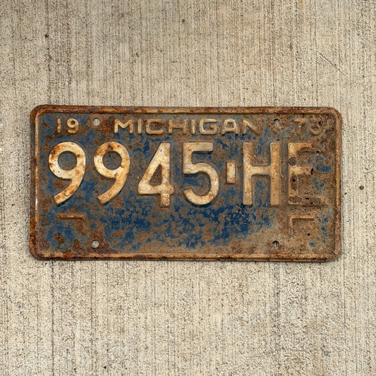 Photo of a 1973 Michigan Commercial License Plate Auto Tag Garage Decor Vintage 9945 HE with original patina