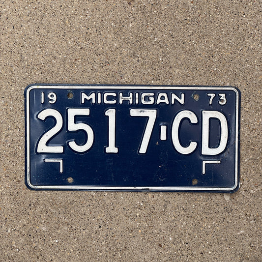 Photo of a 1973 Michigan Commercial Truck License Plate Auto Tag Garage Decor Vintage 2517 CD