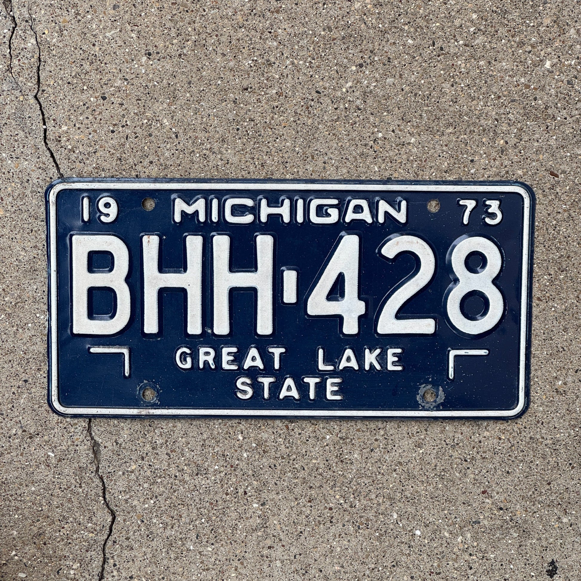 Photo of a 1973 Michigan License Plate Auto Tag Garage Decor Vintage Blue White BHH 428