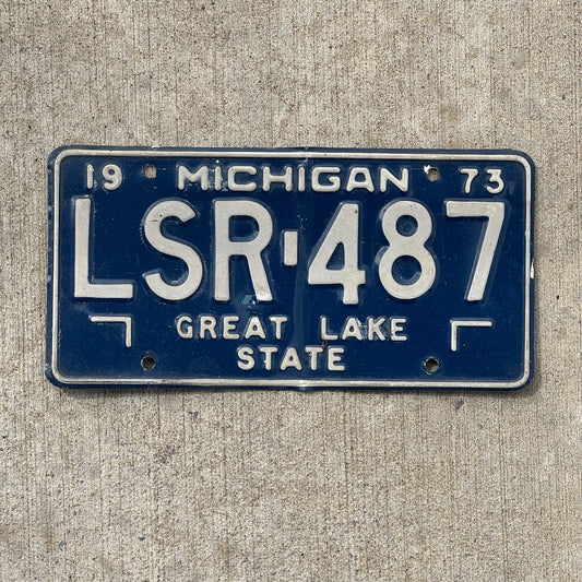 Photo of a 1973 Michigan License Plate Auto Tag Garage Decor Vintage LSR 487 with original patina