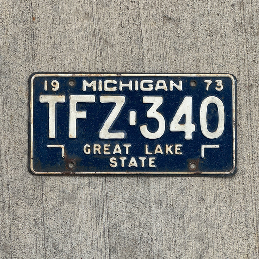 Photo of a 1973 Michigan License Plate Auto Tag Garage Decor Vintage TFZ 340 with original patina