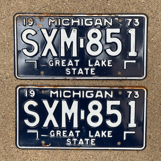 Photo of a 1973 Michigan License Plate Pair Auto Tag Garage Decor Vintage SXM 851