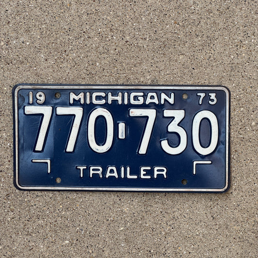 Photo of a 1973 Michigan Trailer License Plate Auto Tag Garage Decor Vintage 770 730