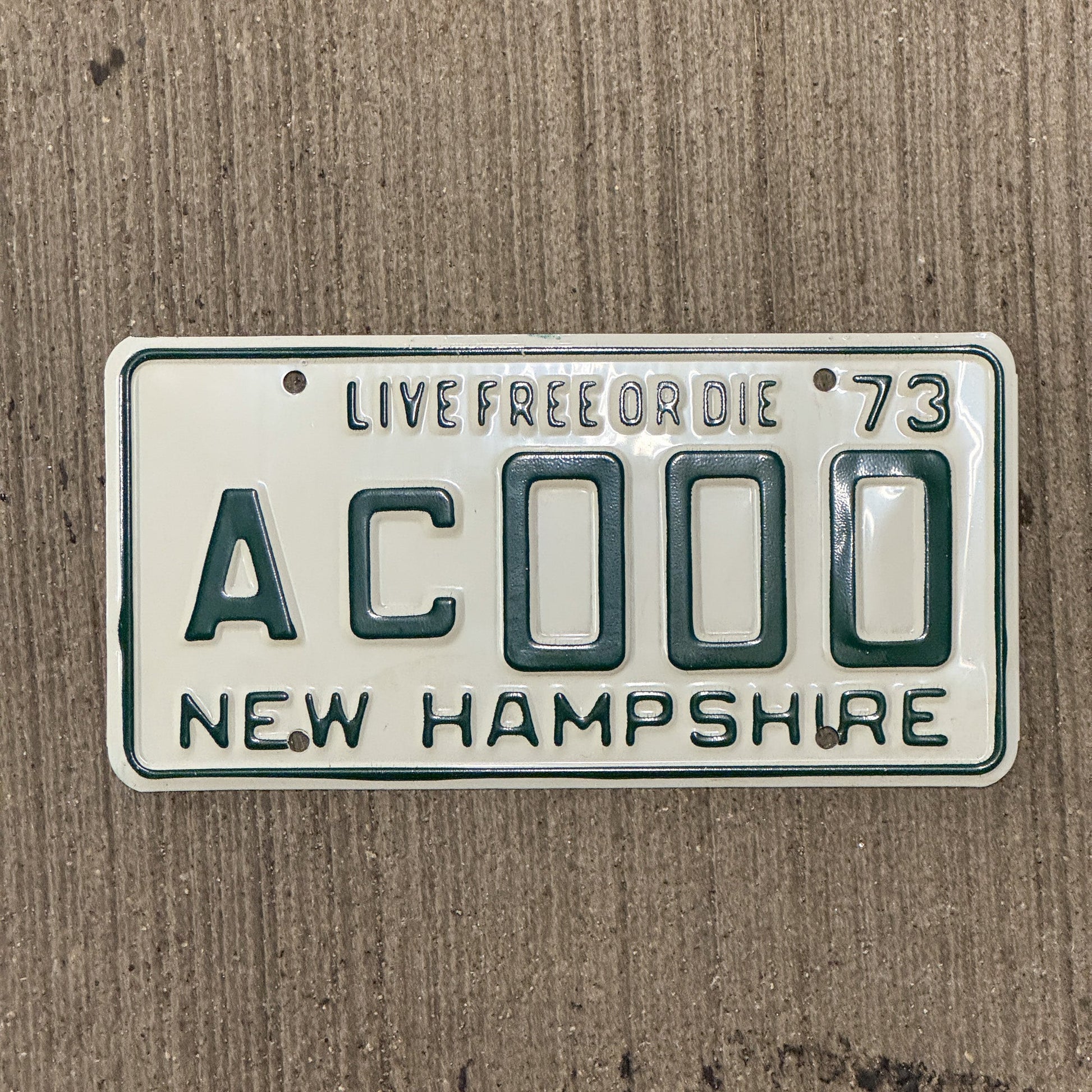 Photo of a 1973 New Hampshire SAMPLE License Plate Auto Tag Garage Decor Vintage AC 000