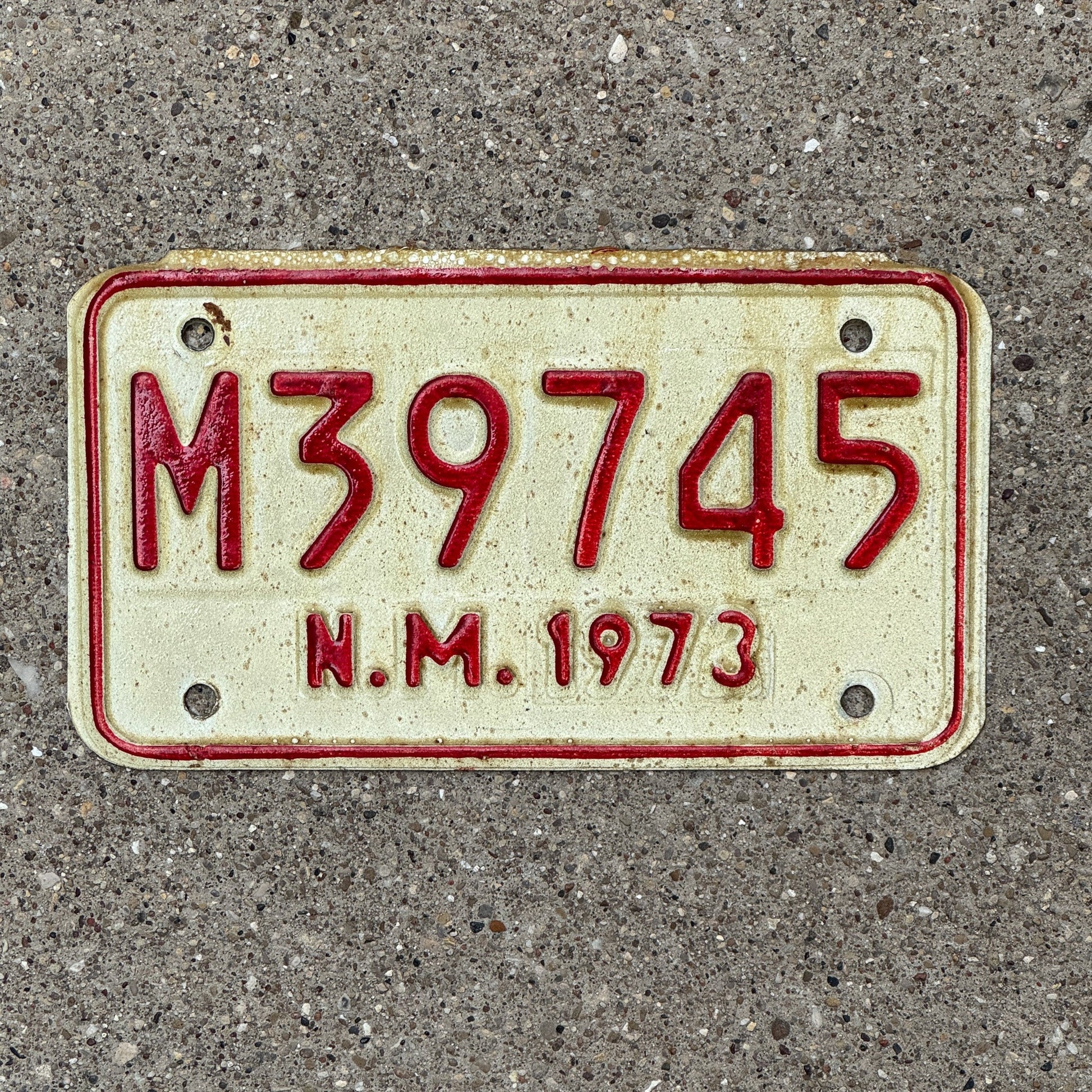 Photo of a 1973 New Mexico Motorcycle License Plate Auto Tag Garage Decor Vintage M 39745 with original patina