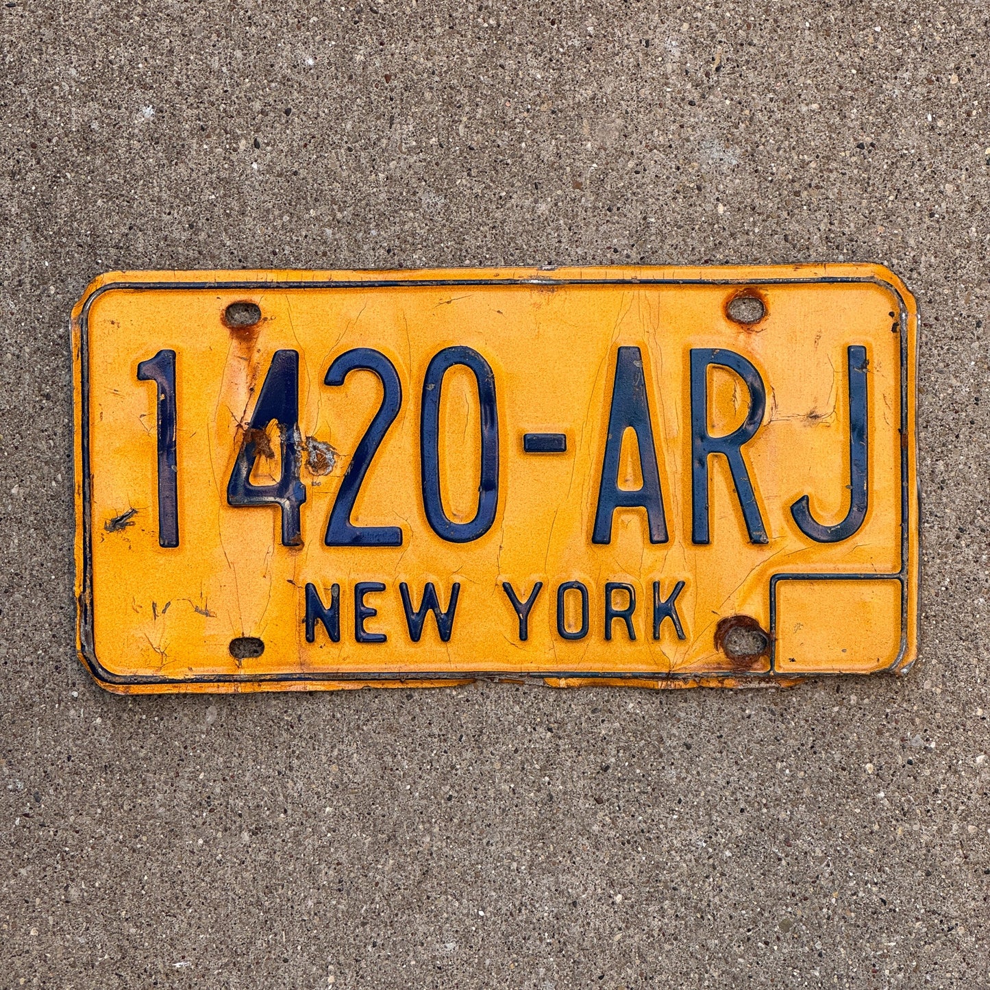 Photo of a 1973 New York License Plate Auto Tag Garage Decor Vintage 420 Weed Smoke 1420 ARJ with original patina